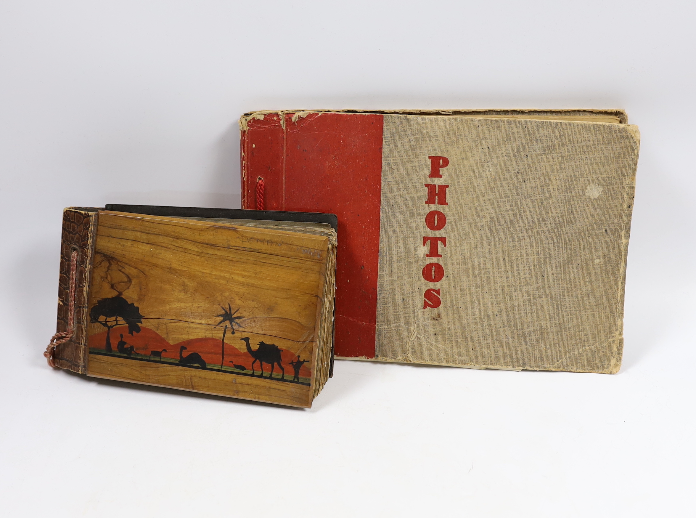 Two photographs albums; an album of early 20th century Middle Eastern travel photographs, together with a 1940s album of mainly naval photographs including war ships and aircraft carriers, some with descriptions on the r